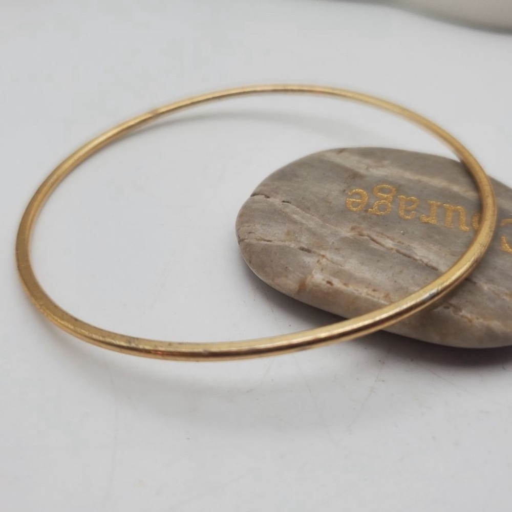 Gold tone bracelet slider